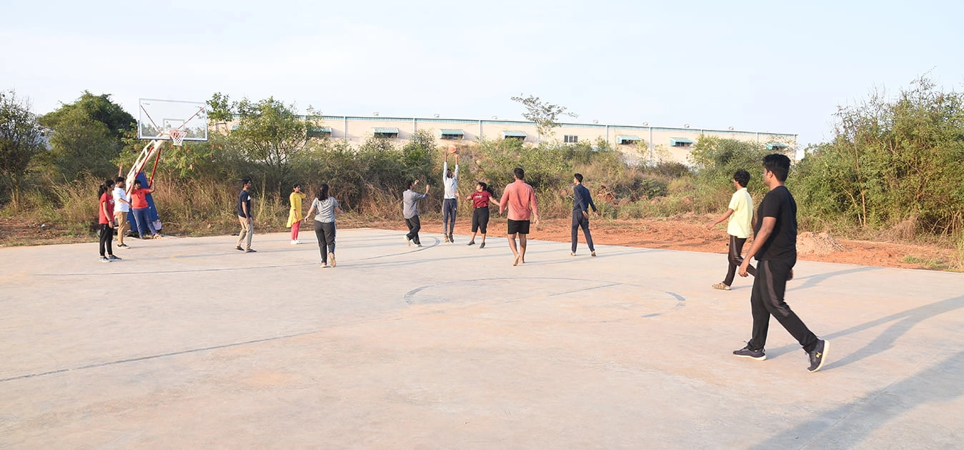 Basketball on The Apollo University outdoor court representing campus sports facility
