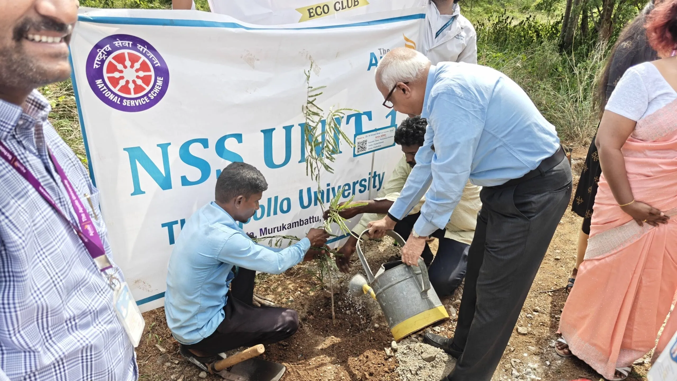 Dr. H. Vinod Bhat planting and watering a sapling during the ECO inauguration of VIVIDHA - Hub.