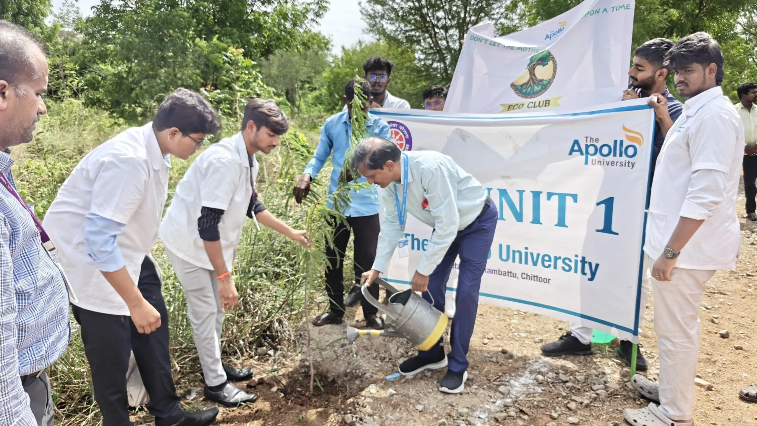 Dr. H. Vinod Bhat planting and watering a sapling during the ECO inauguration of VIVIDHA - Hub.