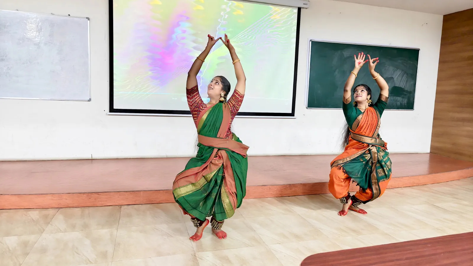 Two performers in traditional attire present a classical dance at the Dance Club inauguration.