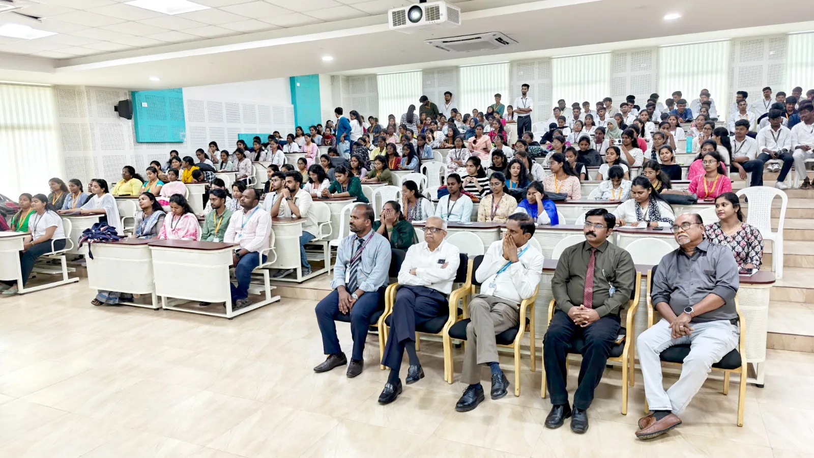 Audience of faculty and students attending the NSS Scarf Distribution Ceremony 2025.