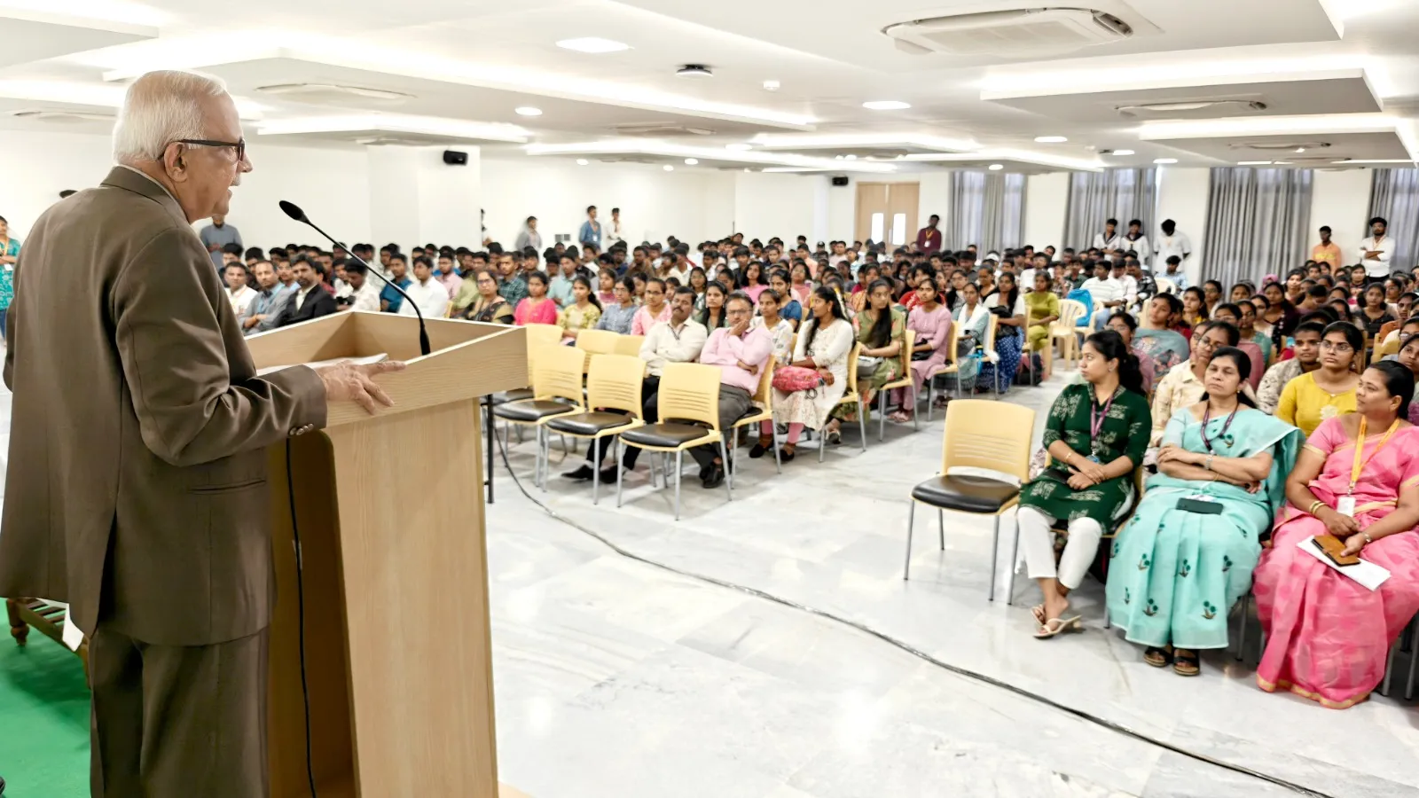 Dean Dr. H. Vinod Bhati addressing students and guests during Adhyay 2025