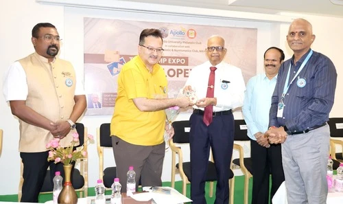 Dr. Kiran Acharya honoring the Vice Chancellor at The Apollo University event.