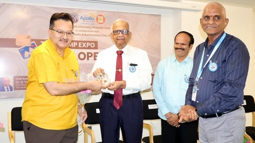 Vice Chancellor receiving honors from Dr. Kiran Acharya at the event.