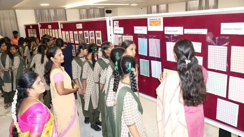 Visitors engaging with exhibitors at ApolloPEX-2025 organized by The Apollo University.