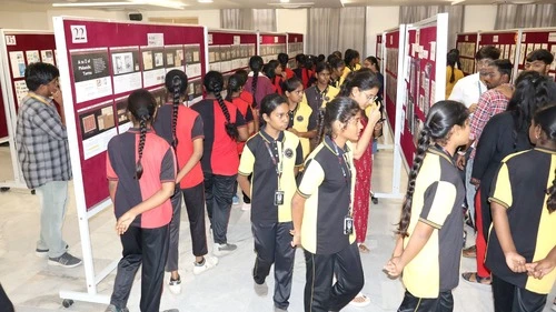 Visitors exploring exhibits at ApolloPEX-2025 at The Apollo University.