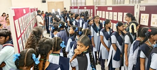 Attendees engaged with displays during the ApolloPEX-2025 event at The Apollo University.