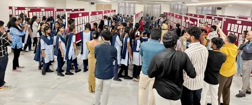 Crowd of visitors interacting at the ApolloPEX-2025 expo held by The Apollo University