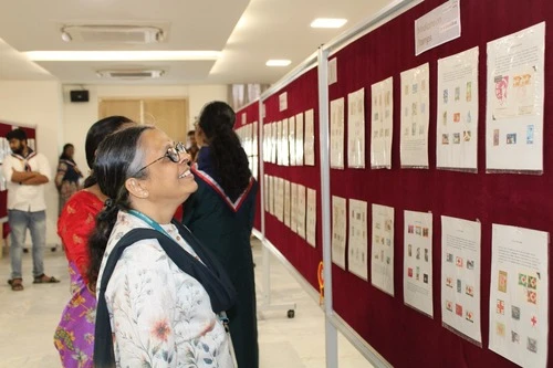 Associate Dean Dr Ramya Ramakrishnan engaging with an exhibition board during the Apollo University workshop