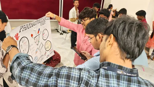 Students present campaign posters on adverse drug reaction awareness