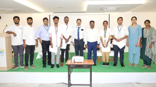 Award-winning student standing on the podium at Apollo Knowledge City
