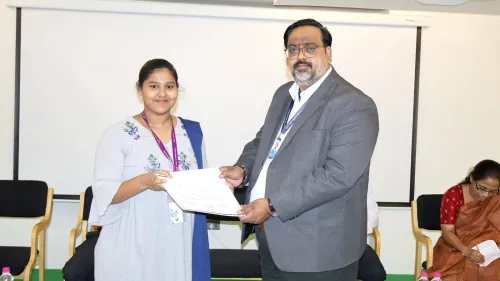 Prof. Bhaskar Reddy presents a certificate to a student at Apollo University