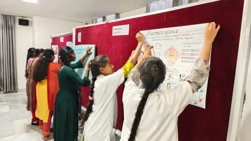 Group presenting posters for safe pharmacovigilance practices