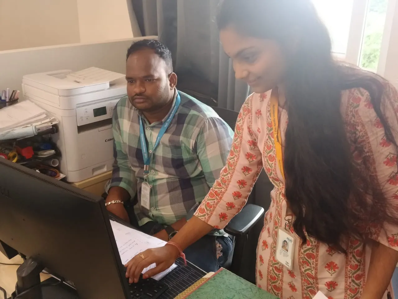 EWYL intern collaborating with faculty member on real-time learning tasks