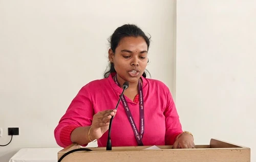 Ms. Gayathri A addressing the audience with an inspiring speech.