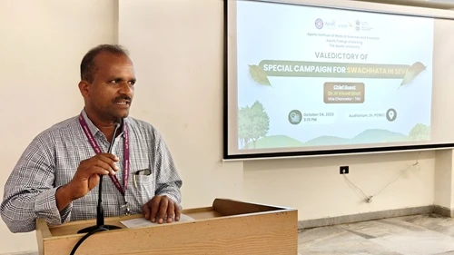 Dr. Hemadri Reddy addressing the audience with an engaging speech.