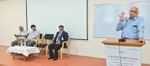 Dr. H. Vinod Bhat speaking to the audience during a formal session at The Apollo University