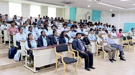 Guest, faculty, and students actively participating in an interactive session at The Apollo University