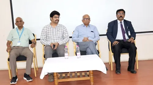 Guest and faculty members captured together in a formal photograph