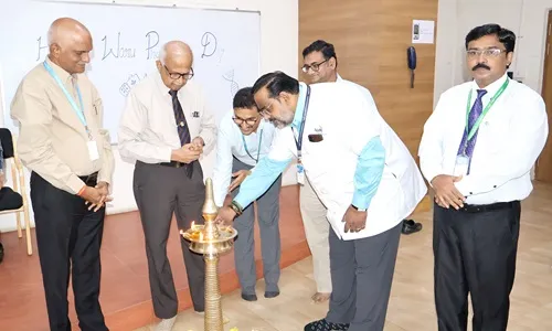 Dr. Bhasker Reddy lighting the ceremonial diya at TAU on World Pharmacists Day 2025.
