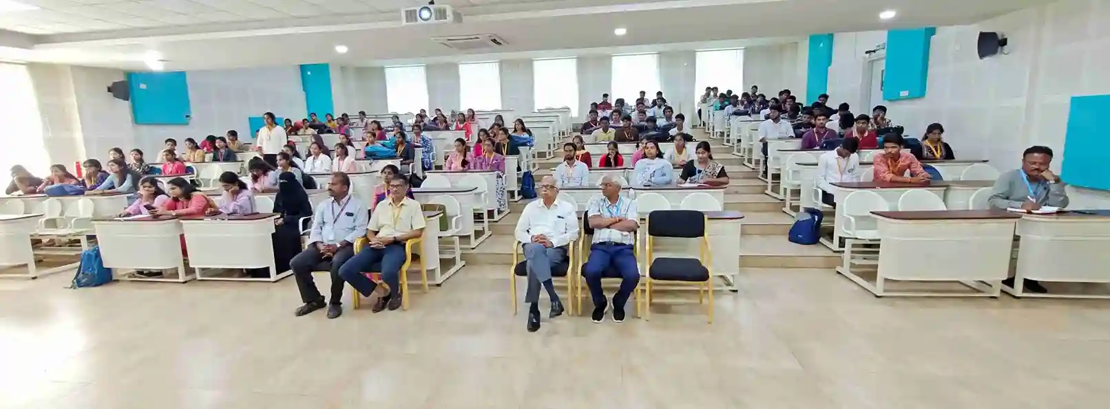 Audience attentively listening during the National Unity Day 2025 celebration event.